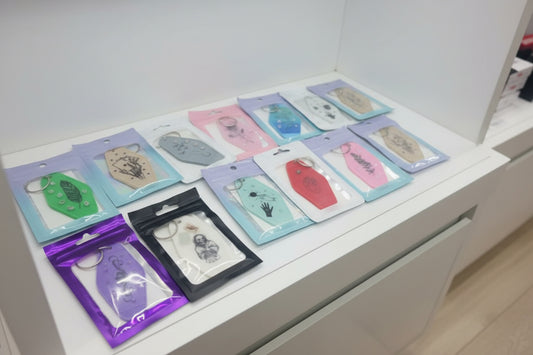 Collection of small, colorful packages with various designs on a dark surface.